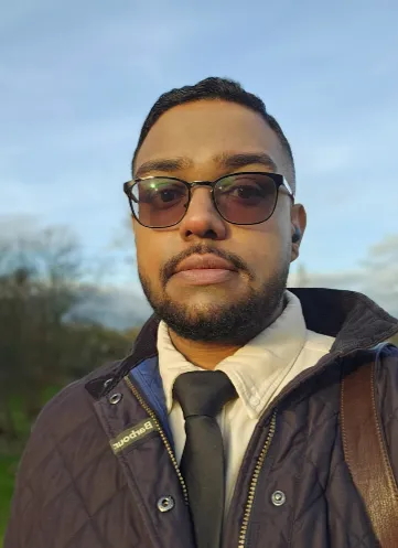 Aaron Melville, a casual head-and-shoulders portrait outdoors.